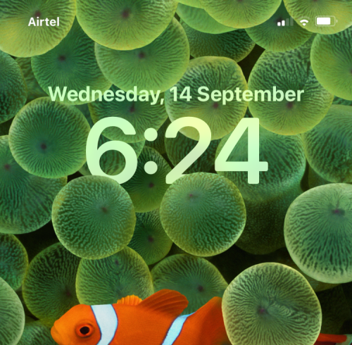 IOS 16 låseskærm: Sådan viser du hele uret foran eller lader emnet komme foran